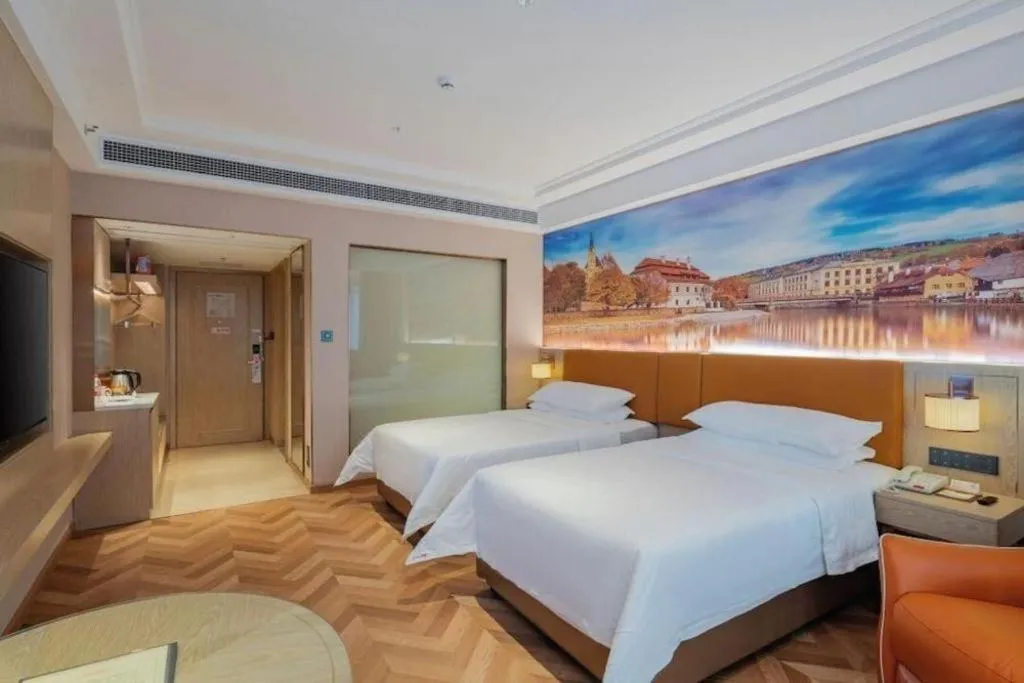Bed in Vienna Hotel Shenzhen Longgang Baifucheng