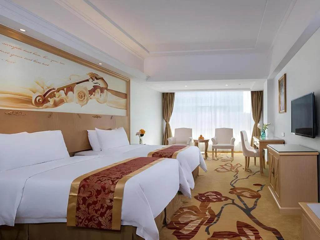 Bed in Vienna Hotel Shenzhen Longgang Baifucheng