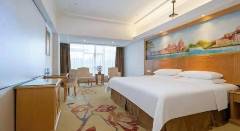 Bed in Vienna Hotel Shenzhen Longgang Baifucheng