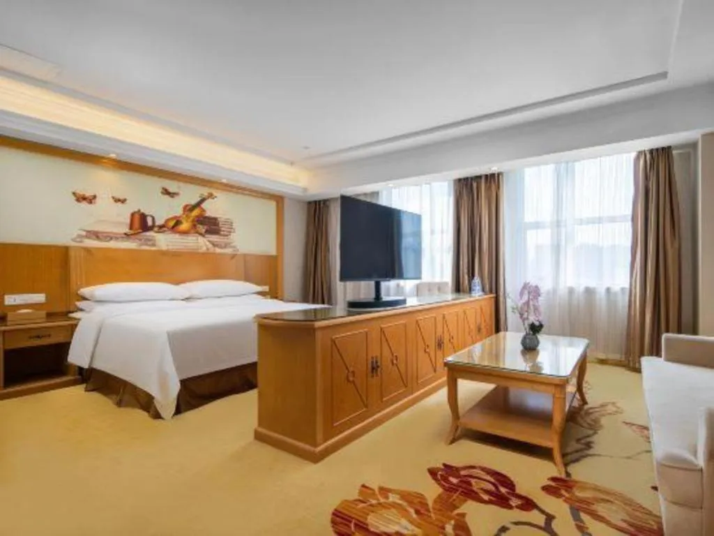 Bed in Vienna Hotel Shenzhen Longgang Baifucheng
