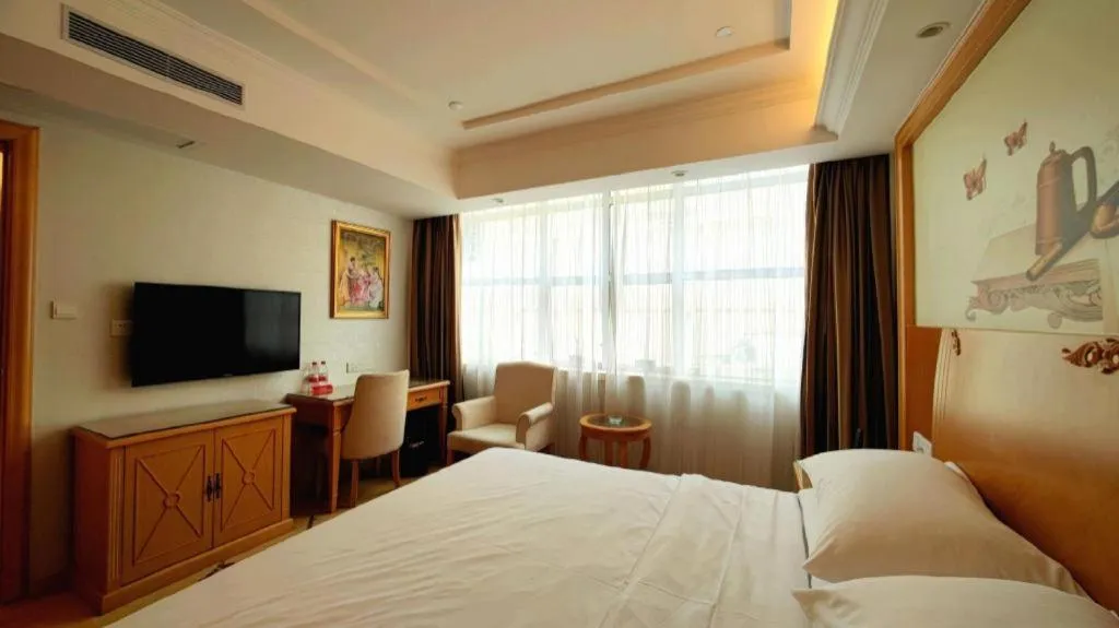 Bed in Vienna Hotel Shenzhen Longgang Baifucheng