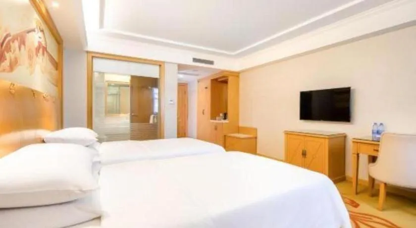 Bed in Vienna Hotel Shenzhen Longgang Baifucheng