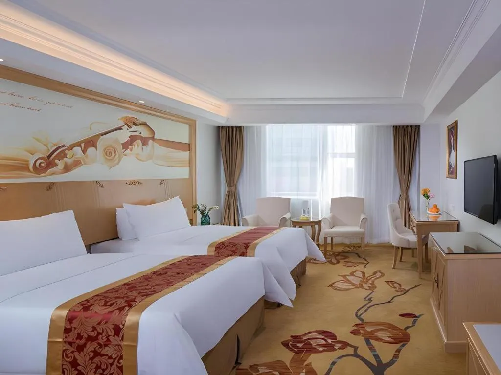 Bed in Vienna Hotel Shenzhen Longgang Baifucheng