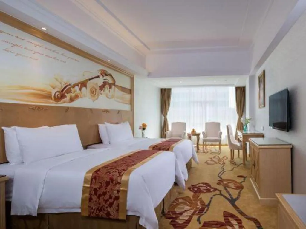 Bed in Vienna Hotel Shenzhen Longgang Baifucheng
