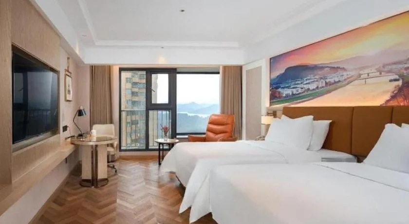 Bed in Vienna Hotel Shenzhen Longgang Baifucheng