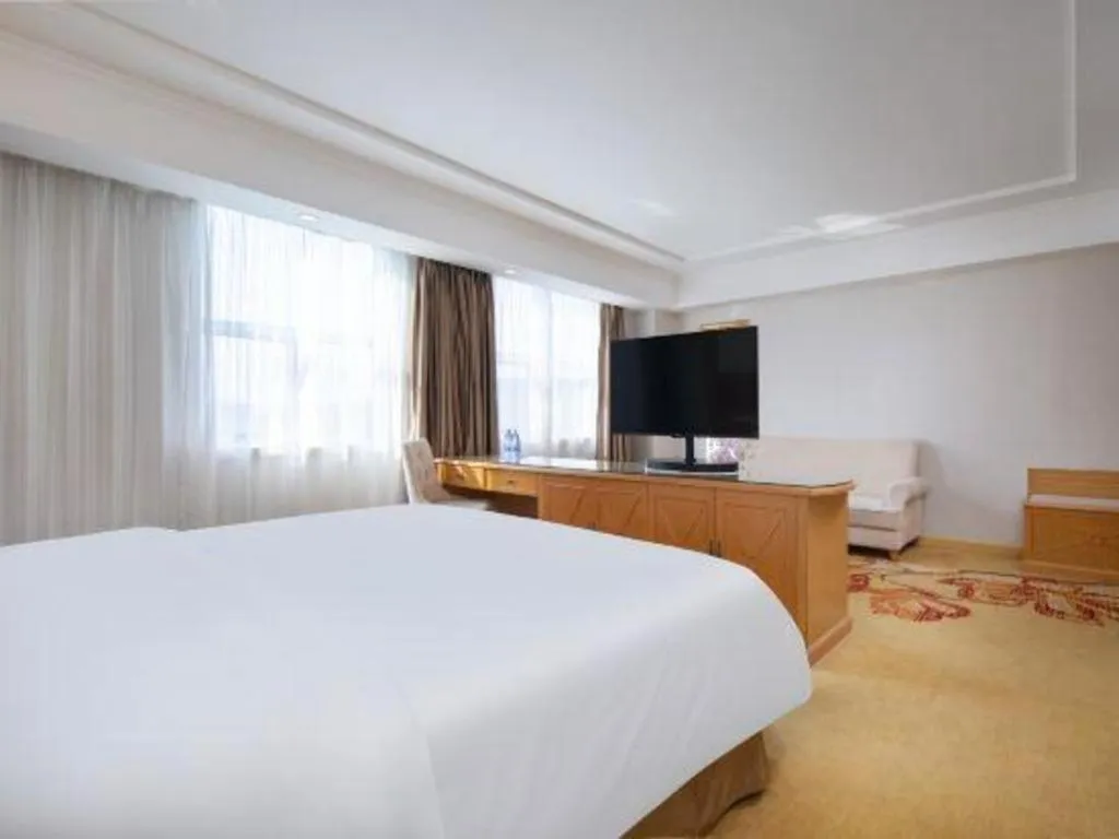 Bed in Vienna Hotel Shenzhen Longgang Baifucheng