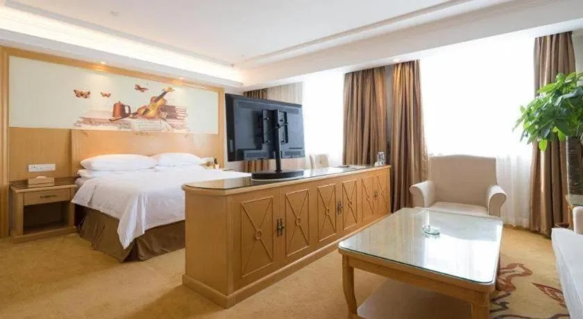 Bed in Vienna Hotel Shenzhen Longgang Baifucheng