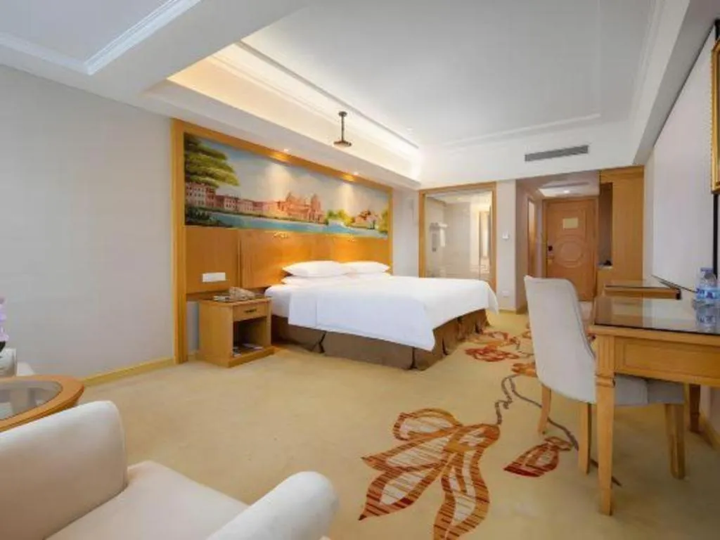 Bed in Vienna Hotel Shenzhen Longgang Baifucheng