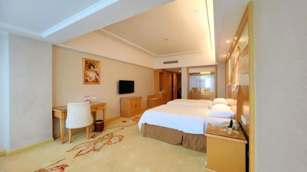 Bed in Vienna Hotel Shenzhen Longgang Baifucheng