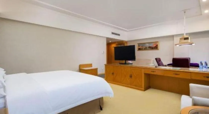 Bed in Vienna Hotel Shenzhen Longgang Baifucheng
