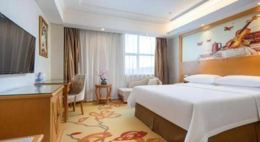 Bed in Vienna Hotel Shenzhen Longgang Baifucheng