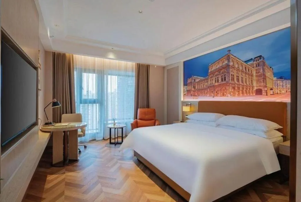 Bed in Vienna Hotel Shenzhen Longgang Baifucheng