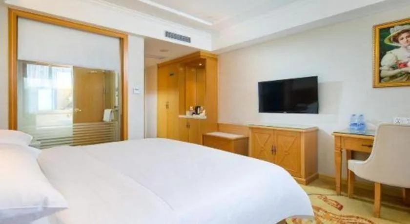 Bed in Vienna Hotel Shenzhen Longgang Baifucheng