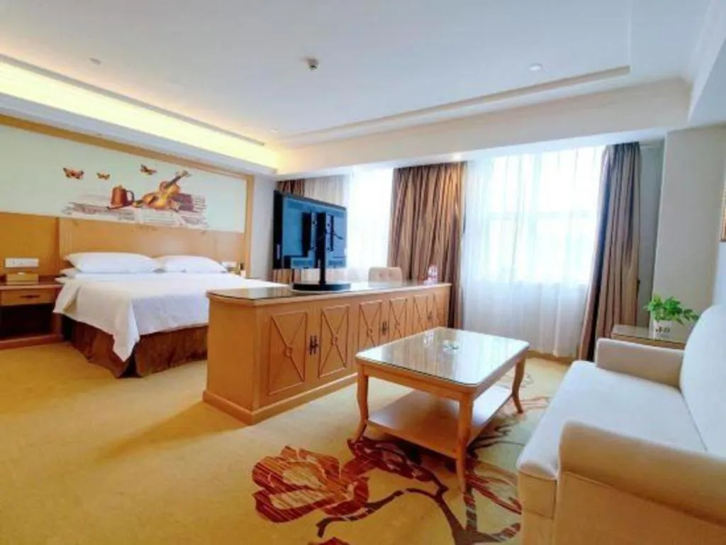 Bed in Vienna Hotel Shenzhen Longgang Baifucheng