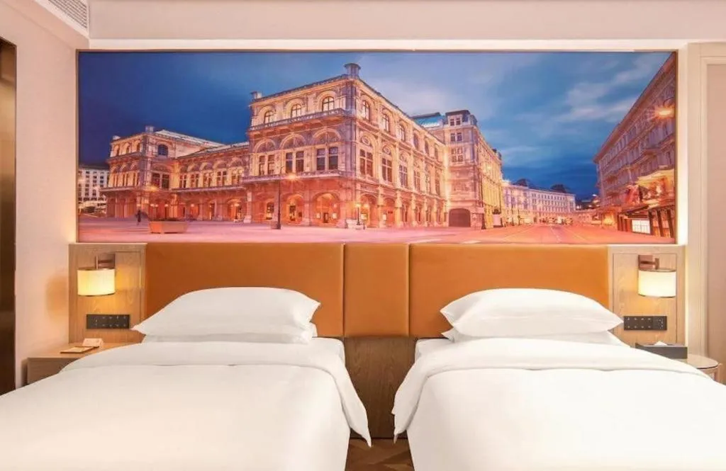 Bed in Vienna Hotel Shenzhen Longgang Baifucheng