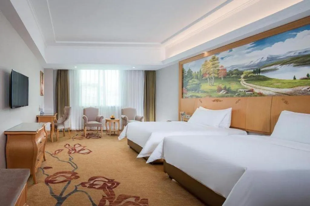 Bed in Vienna Hotel Guangdong Huizhou Lilin North Railway Station
