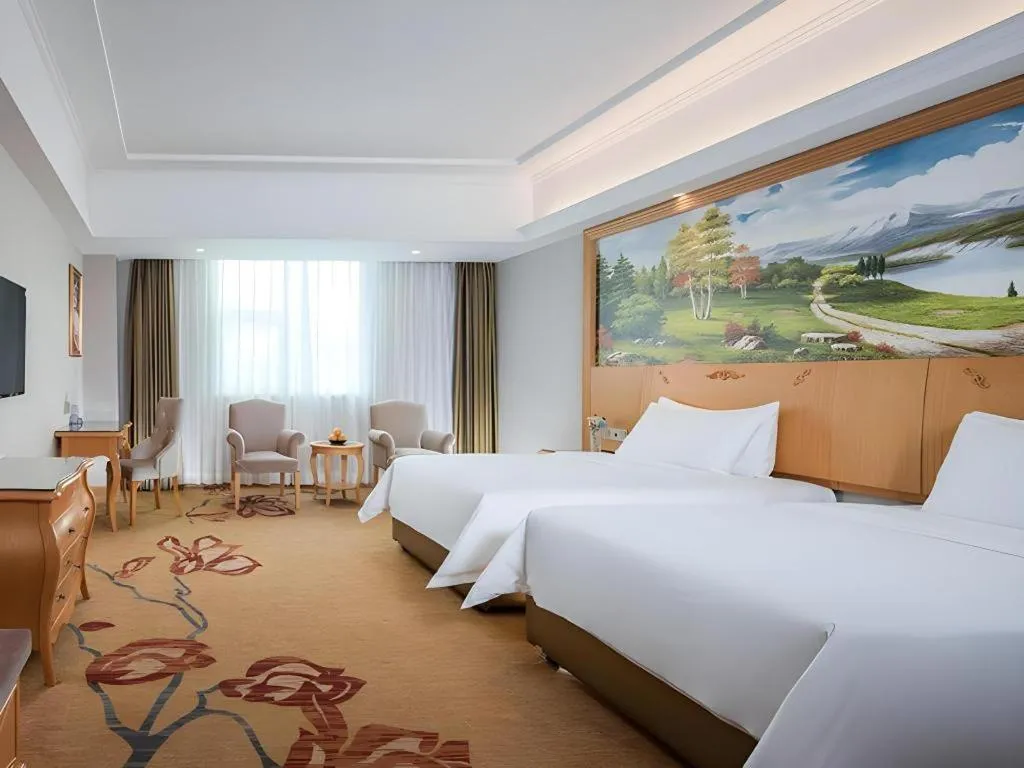 Bed in Vienna Hotel Guangdong Huizhou Lilin North Railway Station