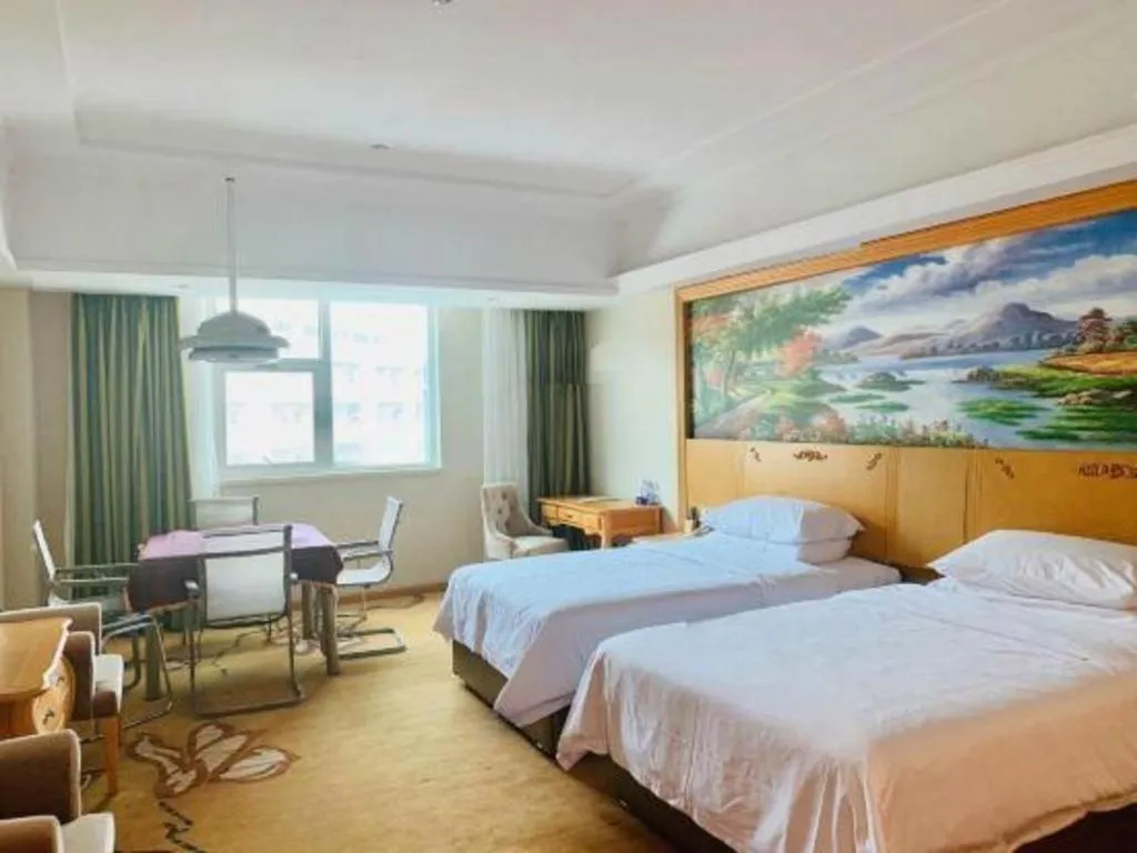 Bed in Vienna Hotel Guangdong Huizhou Lilin North Railway Station