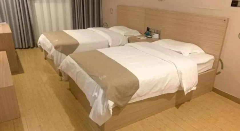 Bed in GreenTree Inn Yancheng Dongtai Fuan Town Express Hotel