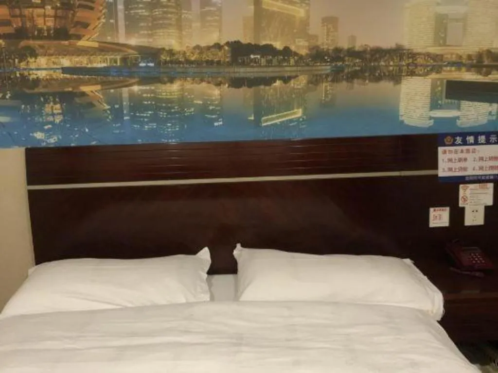 Bed in Shell Hotel Shanghai Baoshan Meilanhu Luosheng Road