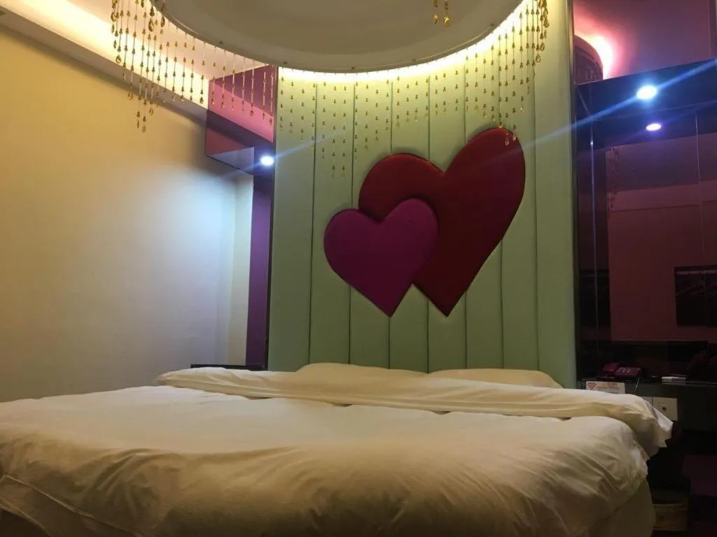 Bed in Shell Hotel Shanghai Baoshan Meilanhu Luosheng Road