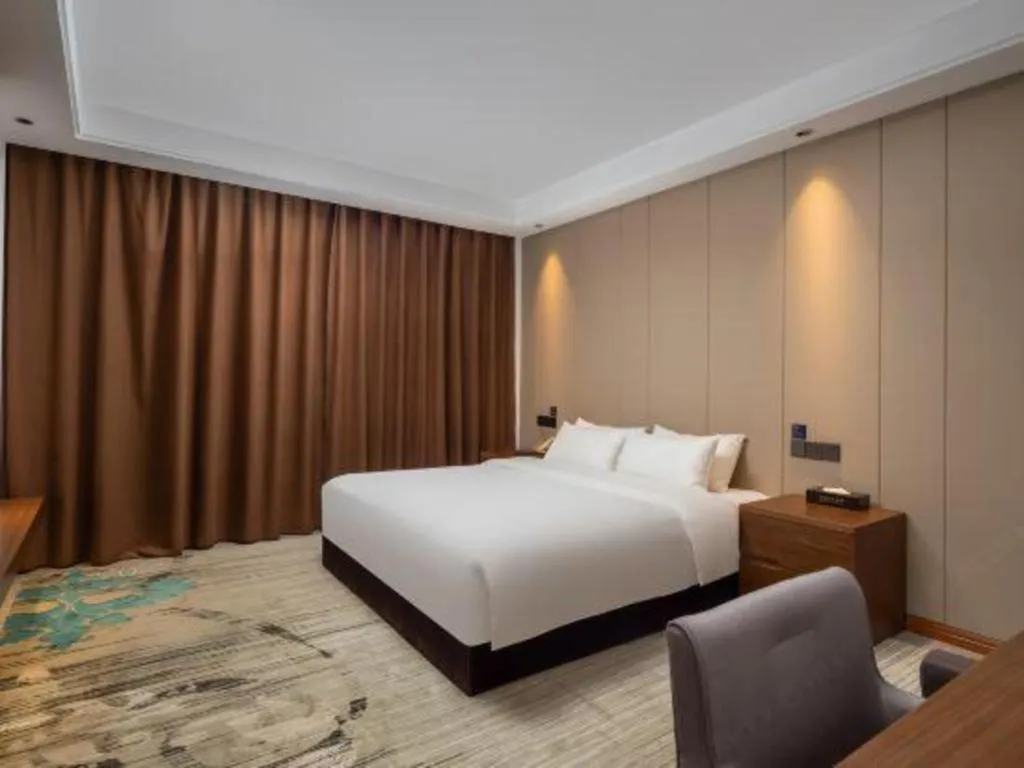 Bed in GME Taizhou Jingjiang City Bus Station Hotel