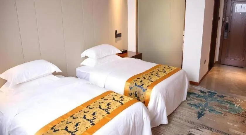 Bed in GME Taizhou Jingjiang City Bus Station Hotel