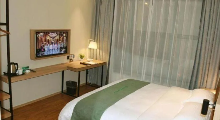 Bed in GreenTree Inn Wuxi Quanshan Center