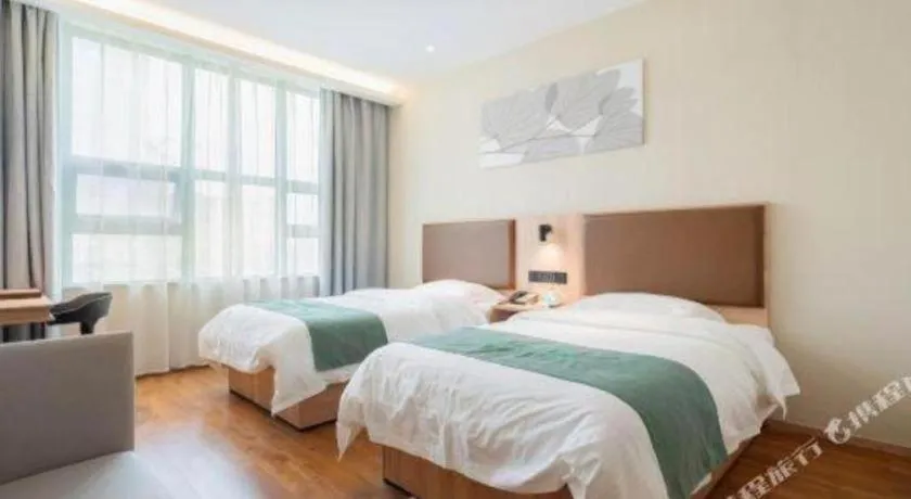 Bed in GreenTree Inn Wuxi Quanshan Center