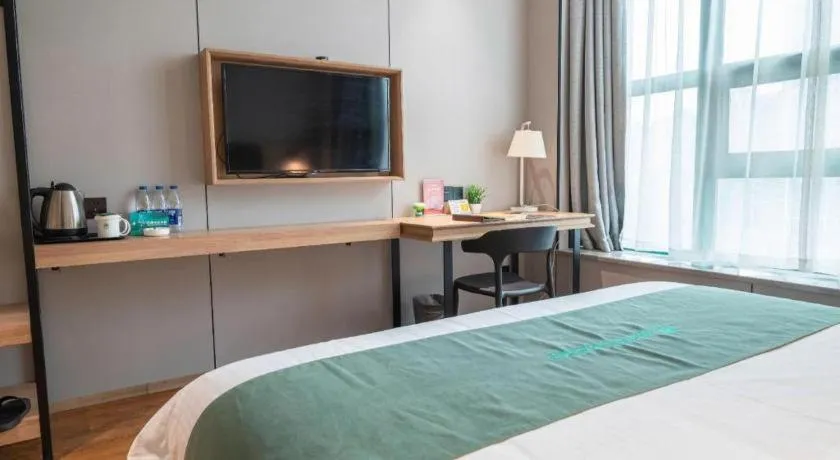 Bed in GreenTree Inn Wuxi Quanshan Center