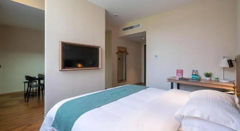 Bed in GreenTree Inn Wuxi Quanshan Center