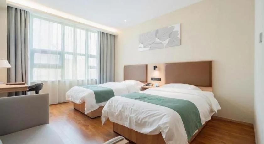 Bed in GreenTree Inn Wuxi Quanshan Center