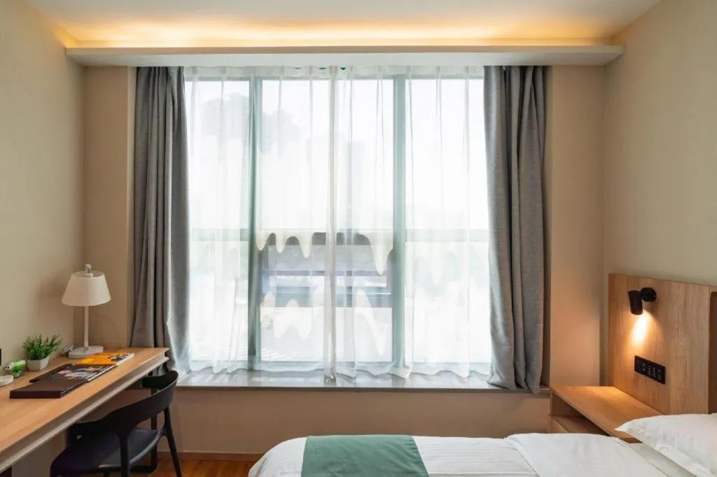 Bed in GreenTree Inn Wuxi Quanshan Center