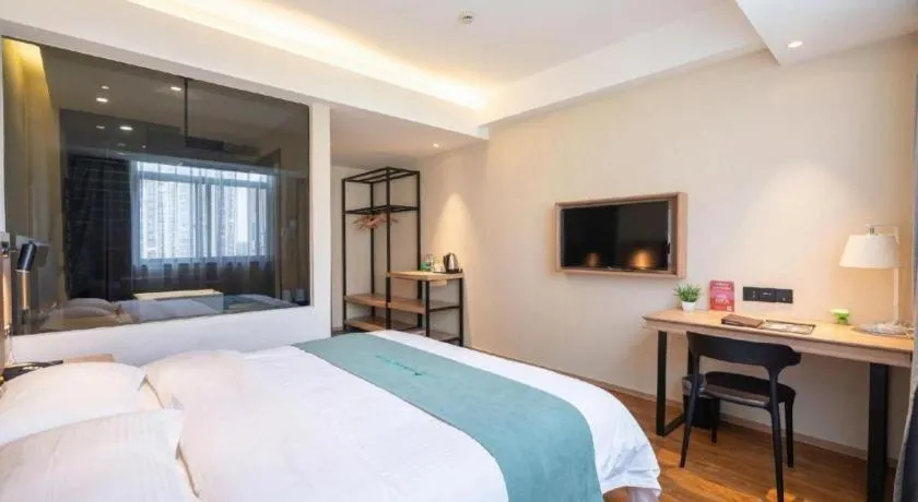 Bed in GreenTree Inn Wuxi Quanshan Center