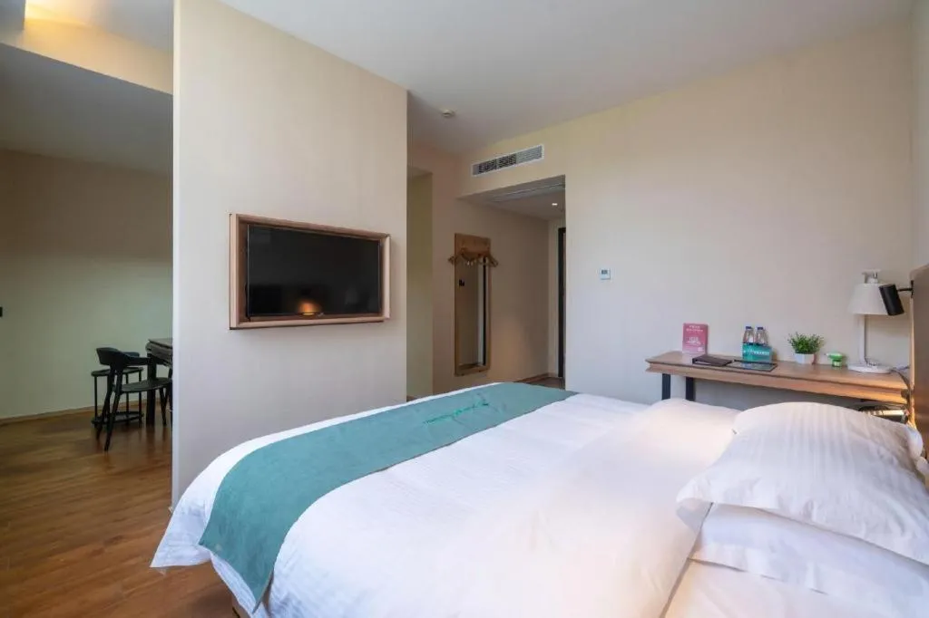 Bed in GreenTree Inn Wuxi Quanshan Center