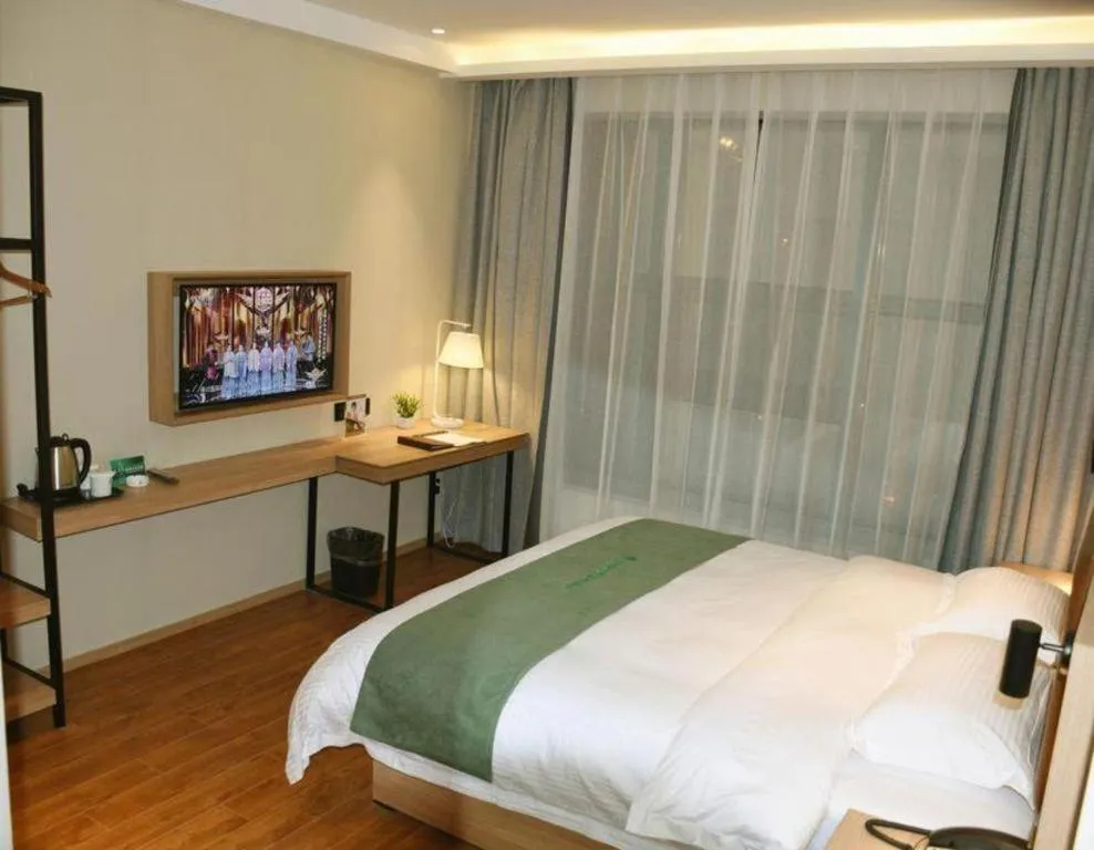 Bed in GreenTree Inn Wuxi Quanshan Center