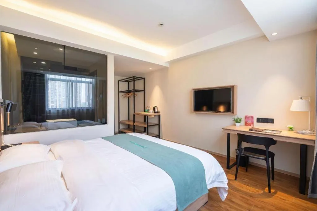 Bed in GreenTree Inn Wuxi Quanshan Center