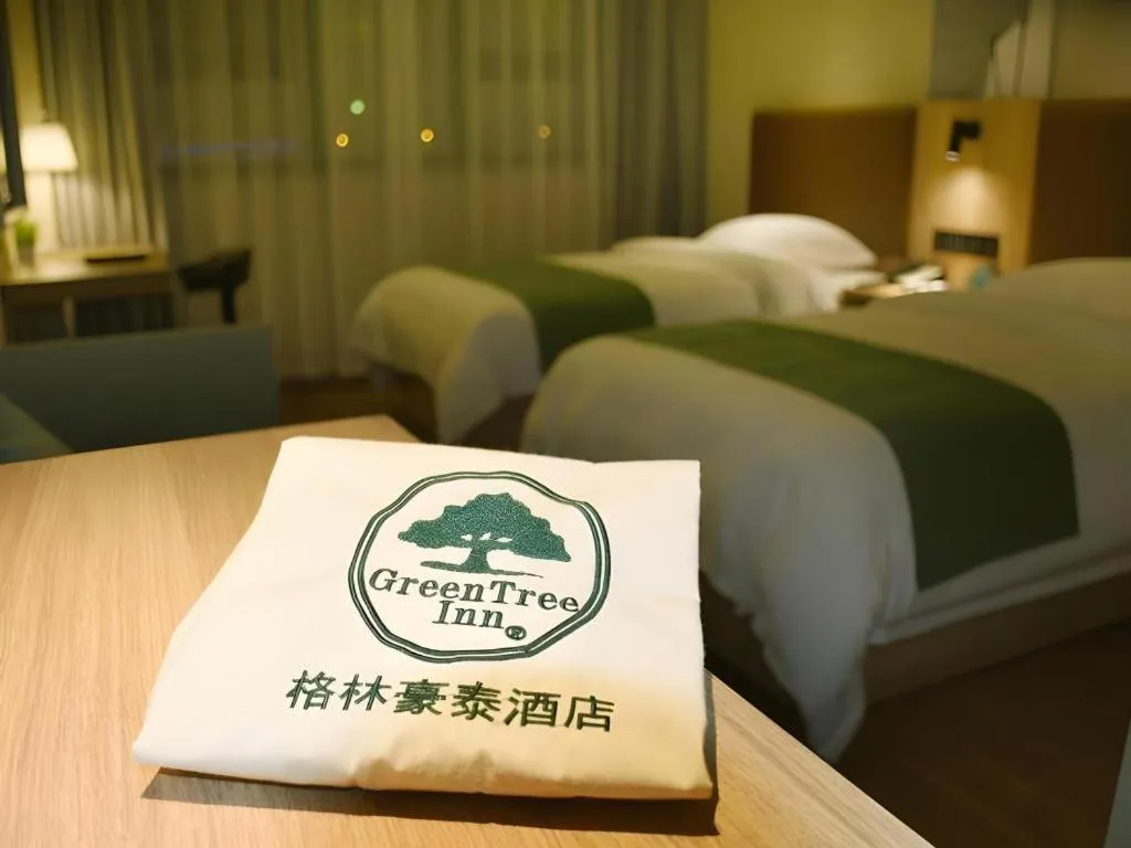 Bed in GreenTree Inn Wuxi Quanshan Center