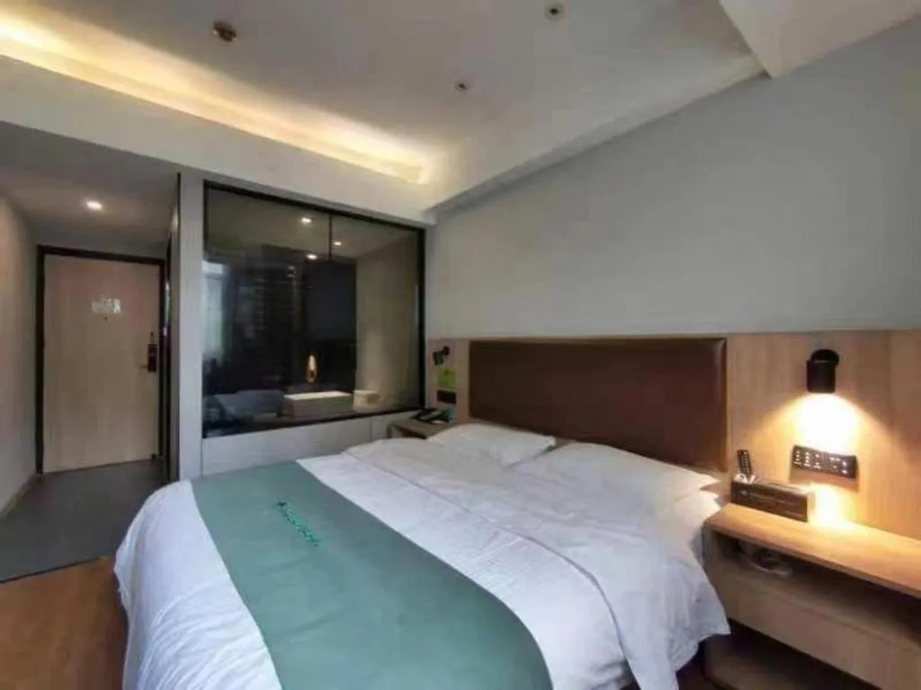 Bed in GreenTree Inn Wuxi Quanshan Center