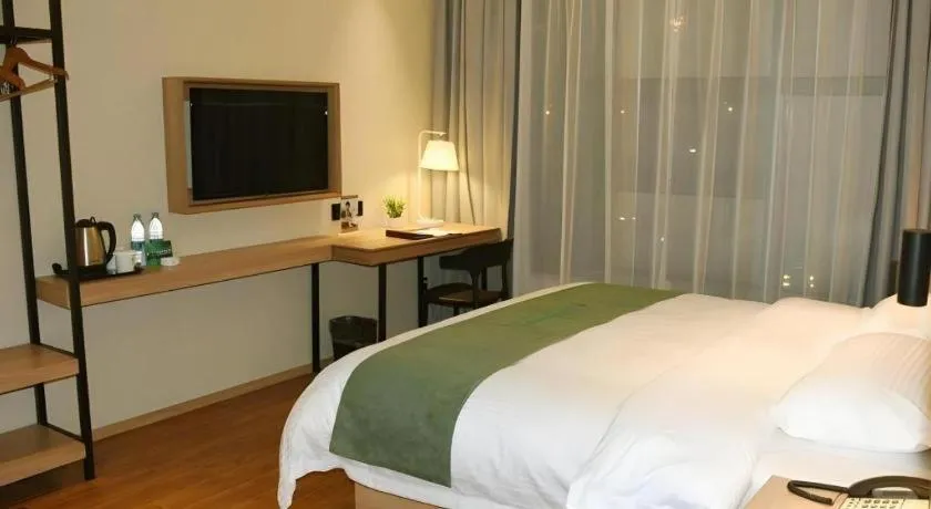 Bed in GreenTree Inn Wuxi Quanshan Center