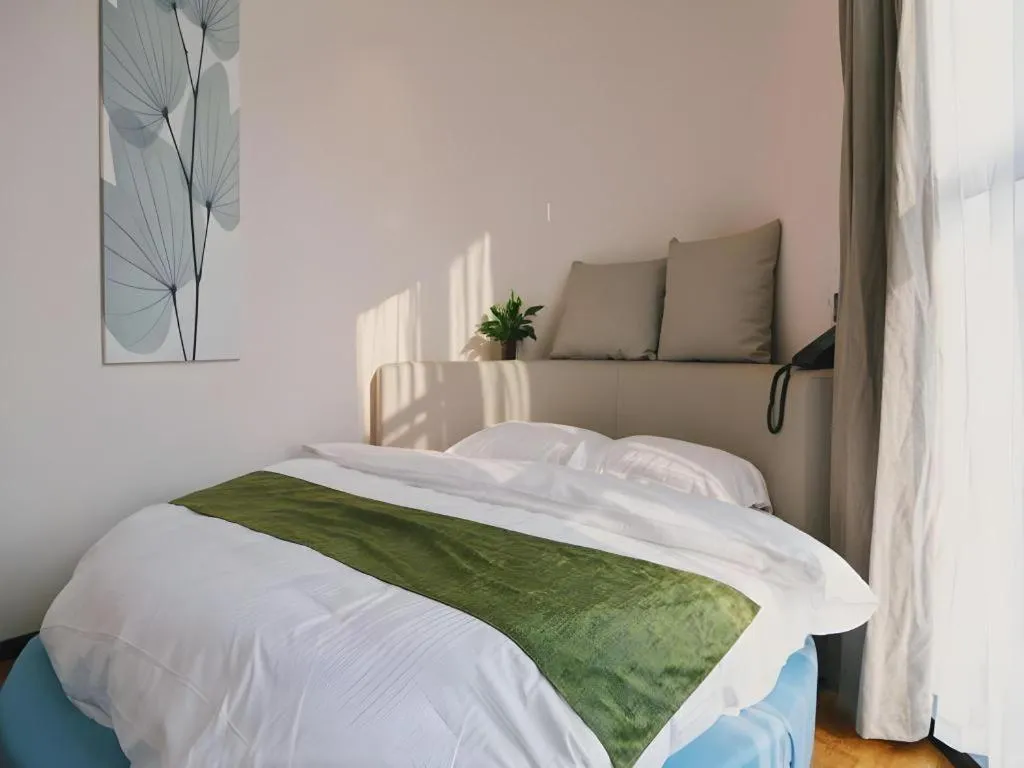 Bed in GreenTree Inn Nanjing Baijiahu