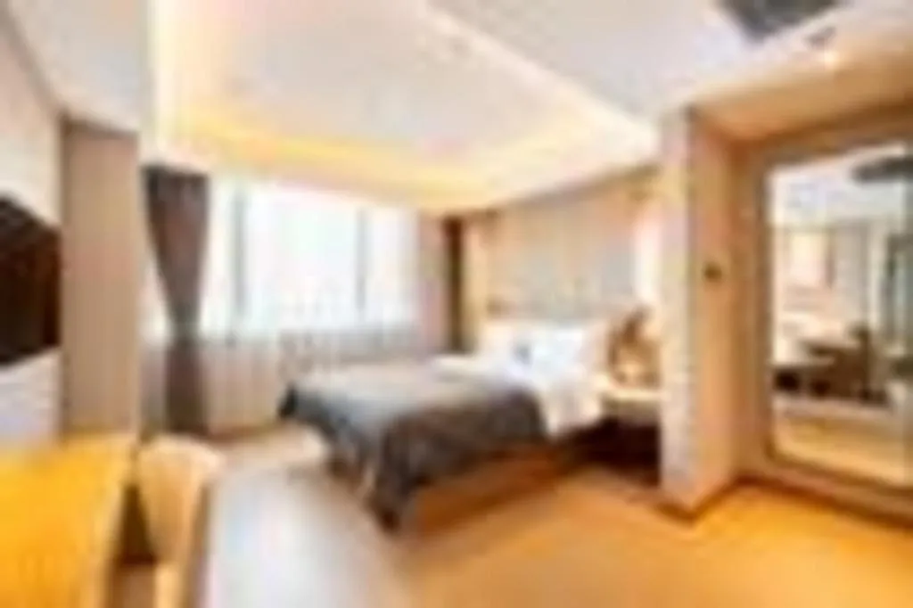Bed in Yitel Collection Shenyang Hunnan Olympic Sports Center Caixia Street Metro Station