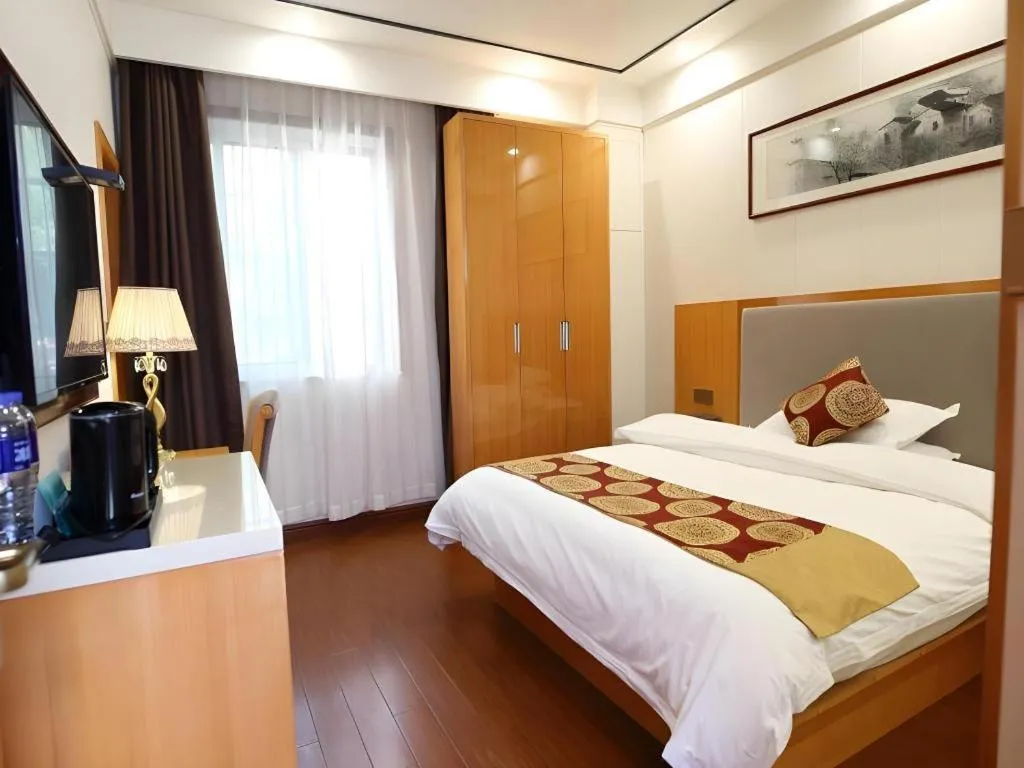 Bed in GreenTree Inn Wuxi Xinwu District Meicun Town Taibo Avenue