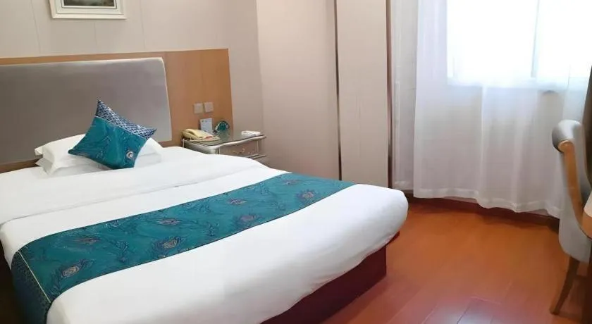 Bed in GreenTree Inn Wuxi Xinwu District Meicun Town Taibo Avenue