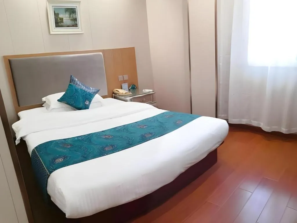 Bed in GreenTree Inn Wuxi Xinwu District Meicun Town Taibo Avenue