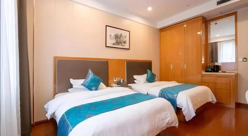 Bed in GreenTree Inn Wuxi Xinwu District Meicun Town Taibo Avenue