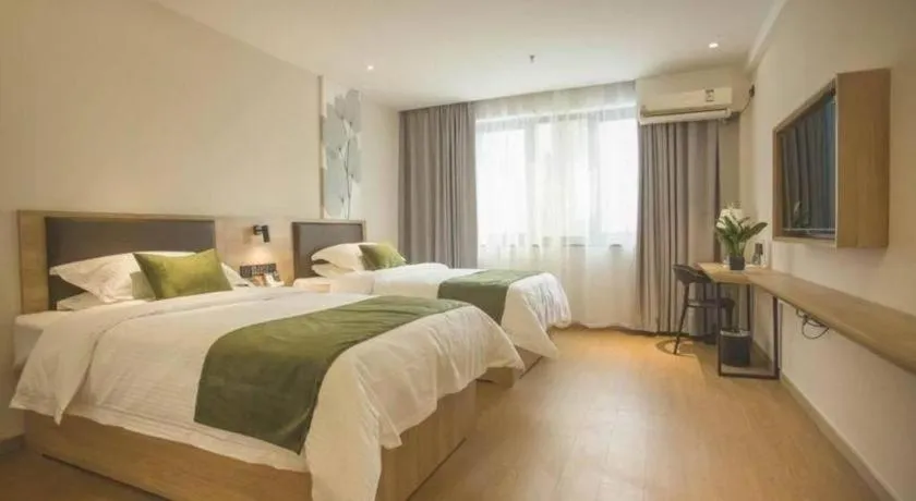 Bed in GreenTree Inn Express Taizhou Jiangyan Hardware City