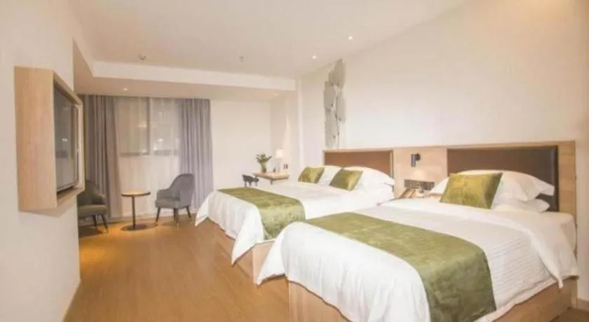 Bed in GreenTree Inn Express Taizhou Jiangyan Hardware City