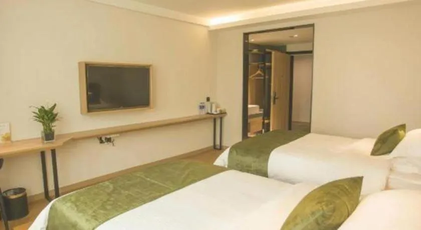 Bed in GreenTree Inn Express Taizhou Jiangyan Hardware City