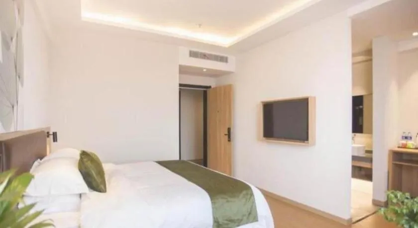 Bed in GreenTree Inn Express Taizhou Jiangyan Hardware City